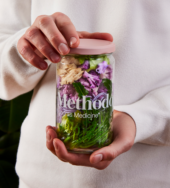 man holding meal in Jar Image